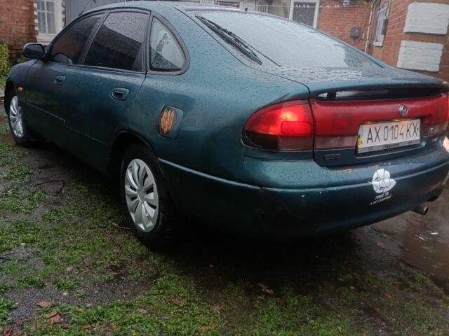 Зеленый Мазда 626, объемом двигателя 2 л и пробегом 350 тыс. км за 1200 $, фото 1 на Automoto.ua