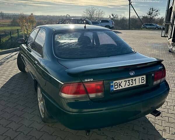 Зеленый Мазда 626, объемом двигателя 2 л и пробегом 300 тыс. км за 1300 $, фото 6 на Automoto.ua