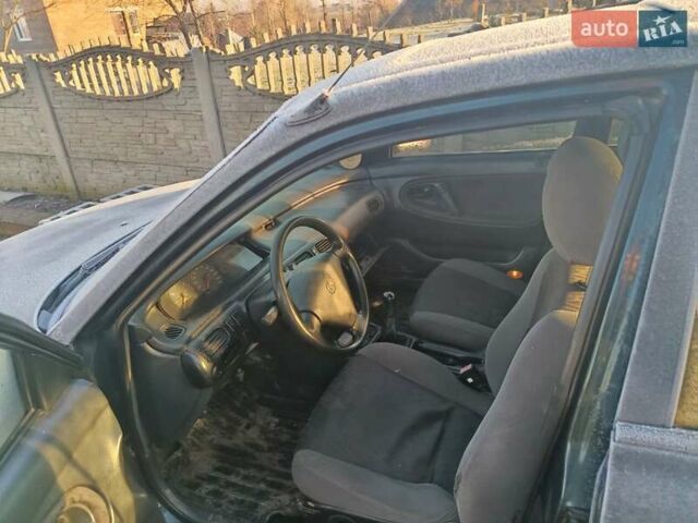Зеленый Мазда 626, объемом двигателя 2 л и пробегом 211 тыс. км за 1450 $, фото 1 на Automoto.ua