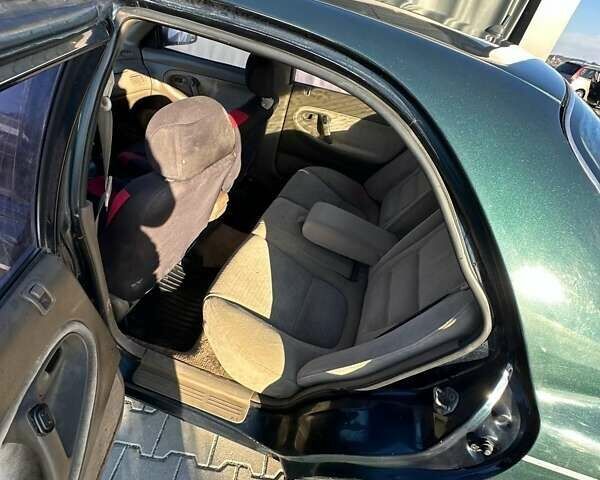 Зеленый Мазда 626, объемом двигателя 2 л и пробегом 300 тыс. км за 1300 $, фото 5 на Automoto.ua