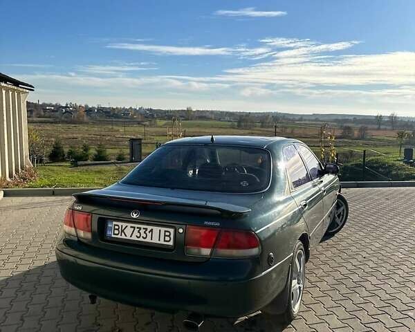Зеленый Мазда 626, объемом двигателя 2 л и пробегом 300 тыс. км за 1300 $, фото 11 на Automoto.ua