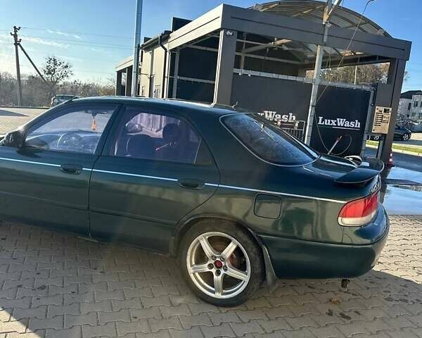 Зеленый Мазда 626, объемом двигателя 2 л и пробегом 300 тыс. км за 1300 $, фото 1 на Automoto.ua