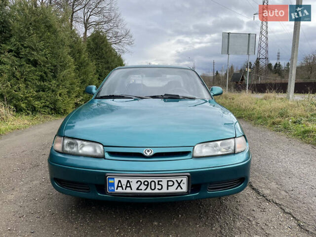 Зеленый Мазда 626, объемом двигателя 2 л и пробегом 401 тыс. км за 1750 $, фото 1 на Automoto.ua