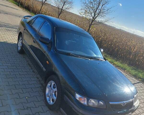 Зеленый Мазда 626, объемом двигателя 2 л и пробегом 378 тыс. км за 2600 $, фото 6 на Automoto.ua