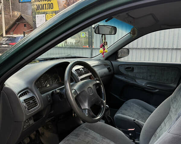 Зеленый Мазда 626, объемом двигателя 2 л и пробегом 356 тыс. км за 2100 $, фото 11 на Automoto.ua