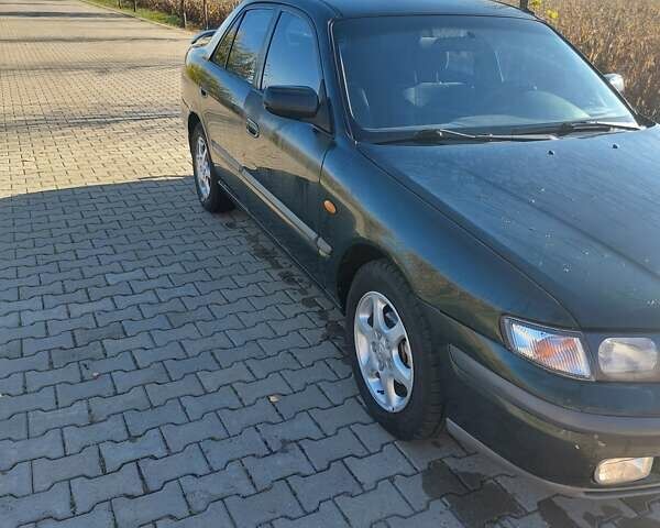 Зеленый Мазда 626, объемом двигателя 2 л и пробегом 378 тыс. км за 2600 $, фото 3 на Automoto.ua