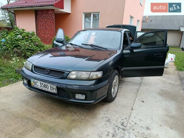 Зеленый Мазда 626, объемом двигателя 2 л и пробегом 270 тыс. км за 1800 $, фото 12 на Automoto.ua