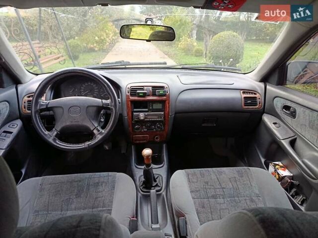 Зеленый Мазда 626, объемом двигателя 2 л и пробегом 270 тыс. км за 1800 $, фото 6 на Automoto.ua