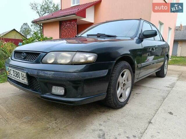 Зеленый Мазда 626, объемом двигателя 2 л и пробегом 270 тыс. км за 1800 $, фото 1 на Automoto.ua