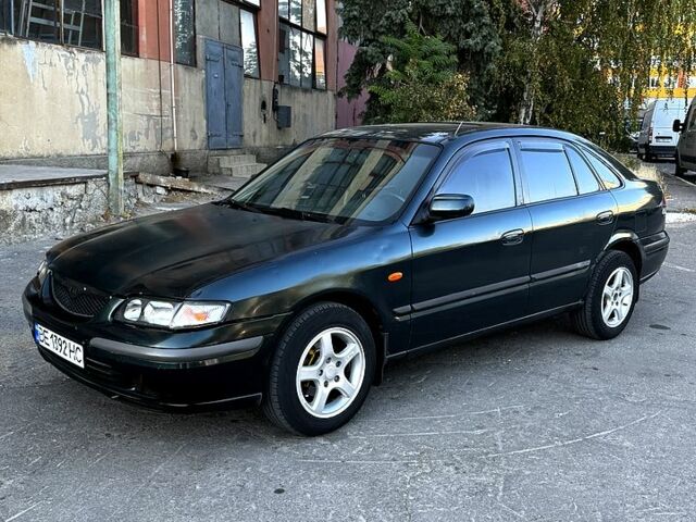 Зеленый Мазда 626, объемом двигателя 2 л и пробегом 185 тыс. км за 2350 $, фото 4 на Automoto.ua