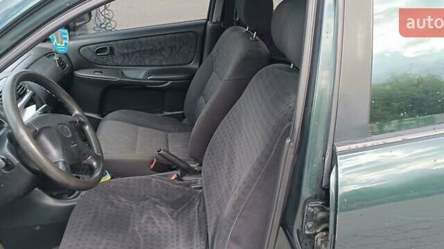 Зеленый Мазда 626, объемом двигателя 1.84 л и пробегом 319 тыс. км за 1700 $, фото 6 на Automoto.ua