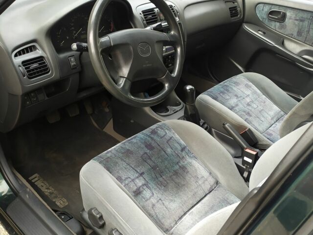 Зеленый Мазда 626, объемом двигателя 2 л и пробегом 250 тыс. км за 3600 $, фото 4 на Automoto.ua