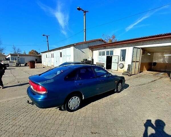 Зеленый Мазда 626, объемом двигателя 2 л и пробегом 250 тыс. км за 2300 $, фото 1 на Automoto.ua