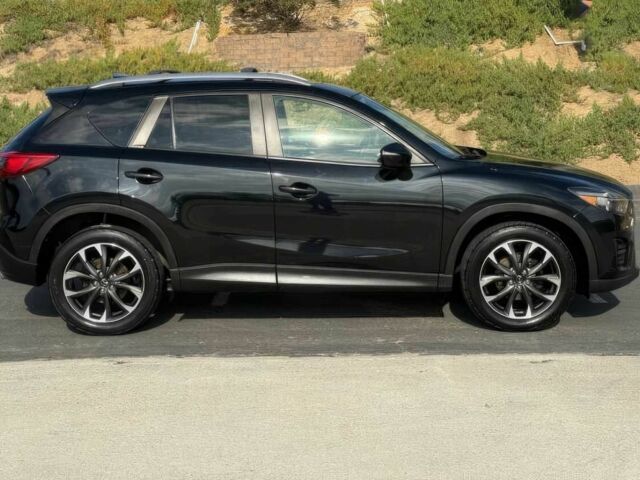 Чорний Мазда СХ-5, об'ємом двигуна 2.5 л та пробігом 78 тис. км за 10000 $, фото 3 на Automoto.ua