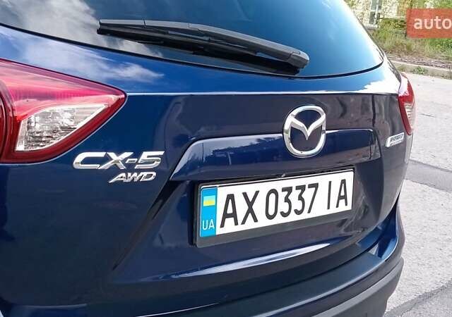 Синий Мазда СХ-5, объемом двигателя 2 л и пробегом 175 тыс. км за 11800 $, фото 25 на Automoto.ua