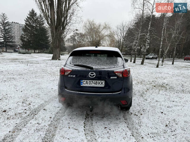 Синий Мазда СХ-5, объемом двигателя 2.19 л и пробегом 275 тыс. км за 12500 $, фото 58 на Automoto.ua