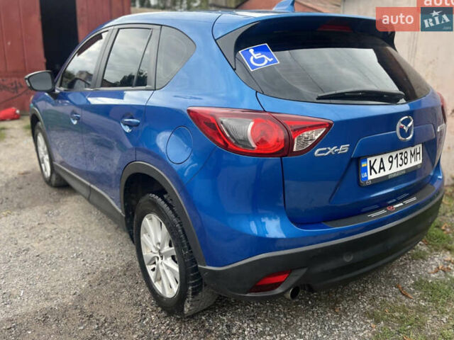 Синий Мазда СХ-5, объемом двигателя 2 л и пробегом 206 тыс. км за 12700 $, фото 4 на Automoto.ua