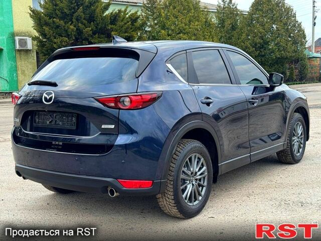 Синий Мазда СХ-5, объемом двигателя 25 л и пробегом 141 тыс. км за 15400 $, фото 4 на Automoto.ua