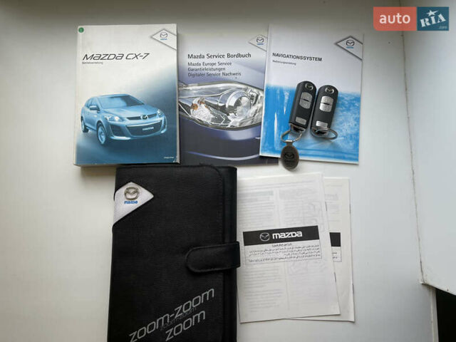 Белый Мазда СХ-7, объемом двигателя 2.2 л и пробегом 225 тыс. км за 9999 $, фото 24 на Automoto.ua