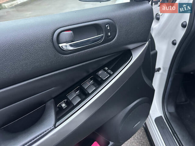 Білий Мазда СХ-7, об'ємом двигуна 2.2 л та пробігом 243 тис. км за 10999 $, фото 26 на Automoto.ua