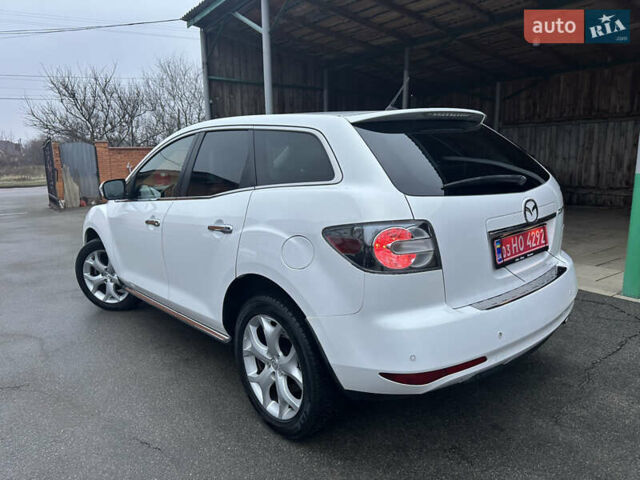 Білий Мазда СХ-7, об'ємом двигуна 2.2 л та пробігом 243 тис. км за 10999 $, фото 14 на Automoto.ua