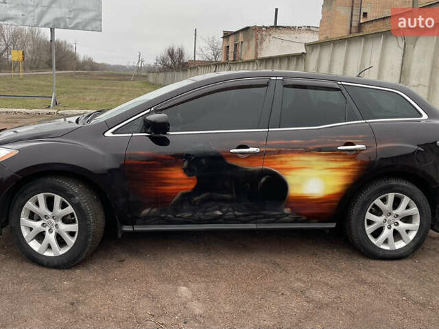 Черный Мазда СХ-7, объемом двигателя 2.3 л и пробегом 135 тыс. км за 7500 $, фото 3 на Automoto.ua