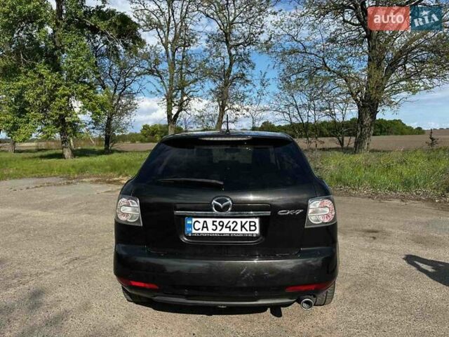 Черный Мазда СХ-7, объемом двигателя 2.2 л и пробегом 221 тыс. км за 11000 $, фото 1 на Automoto.ua