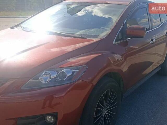 Красный Мазда СХ-7, объемом двигателя 2.3 л и пробегом 145 тыс. км за 6700 $, фото 1 на Automoto.ua