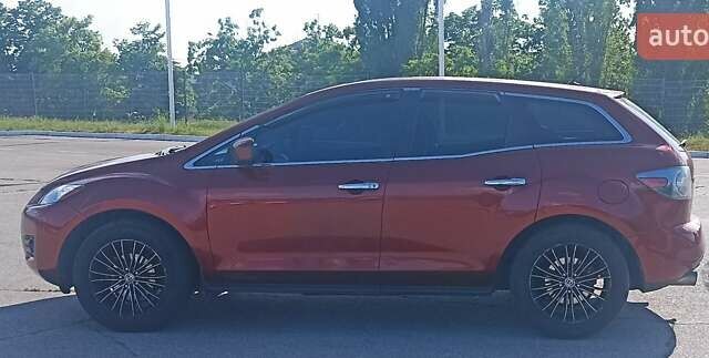 Красный Мазда СХ-7, объемом двигателя 2.3 л и пробегом 145 тыс. км за 6700 $, фото 3 на Automoto.ua