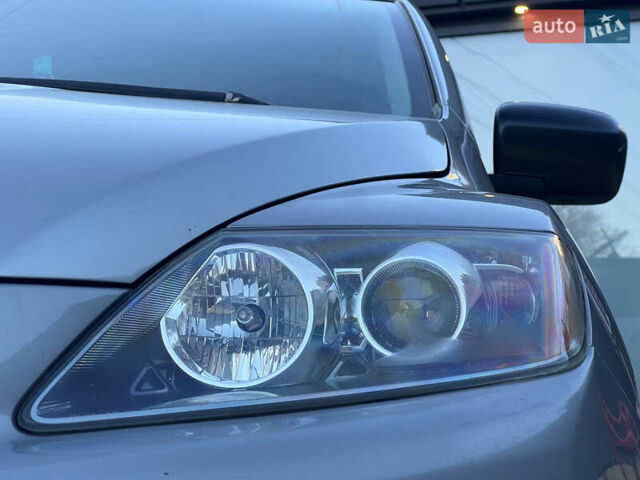 Серый Мазда СХ-7, объемом двигателя 2.3 л и пробегом 210 тыс. км за 6750 $, фото 2 на Automoto.ua