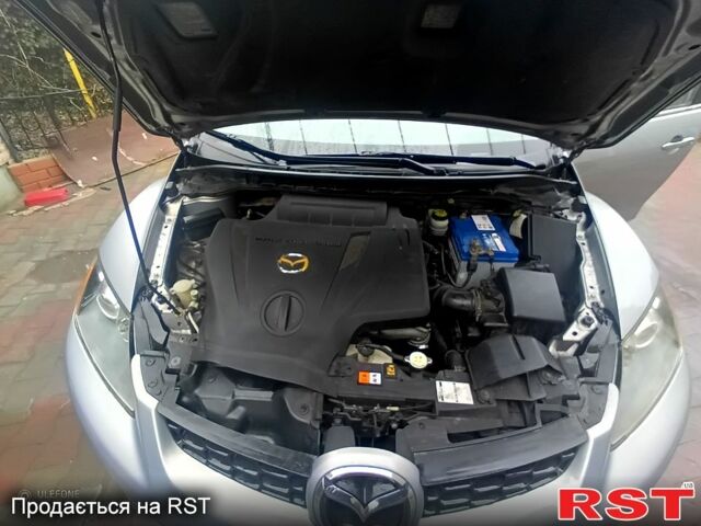 Серый Мазда СХ-7, объемом двигателя 2.3 л и пробегом 99 тыс. км за 6000 $, фото 1 на Automoto.ua