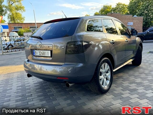 Серый Мазда СХ-7, объемом двигателя 2.3 л и пробегом 185 тыс. км за 6800 $, фото 4 на Automoto.ua