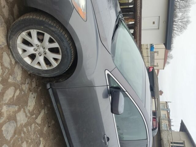 Серый Мазда СХ-7, объемом двигателя 2.3 л и пробегом 235 тыс. км за 7777 $, фото 1 на Automoto.ua