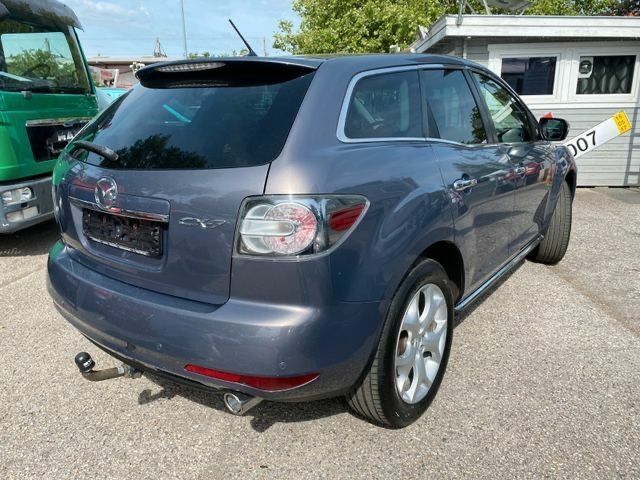 Серый Мазда СХ-7, объемом двигателя 2.2 л и пробегом 215 тыс. км за 6415 $, фото 3 на Automoto.ua