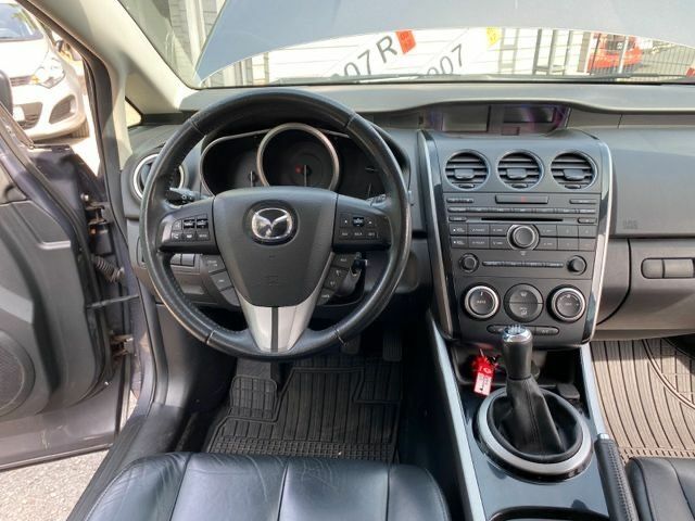 Серый Мазда СХ-7, объемом двигателя 2.2 л и пробегом 215 тыс. км за 6415 $, фото 4 на Automoto.ua