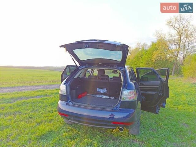 Синий Мазда СХ-7, объемом двигателя 2.18 л и пробегом 148 тыс. км за 11300 $, фото 5 на Automoto.ua