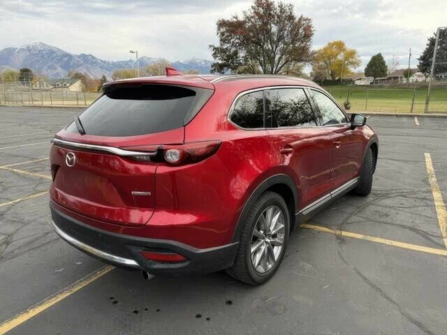 Червоний Мазда СХ-9, об'ємом двигуна 2.5 л та пробігом 28 тис. км за 5600 $, фото 3 на Automoto.ua