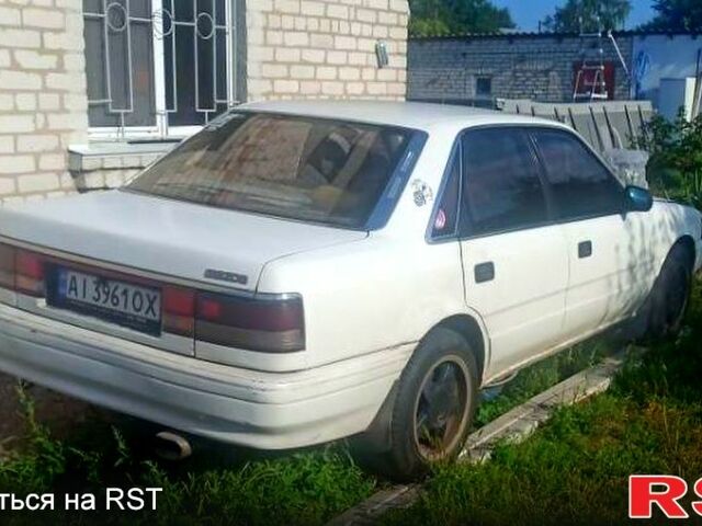 Белый Мазда Капелла, объемом двигателя 1.8 л и пробегом 520 тыс. км за 700 $, фото 1 на Automoto.ua