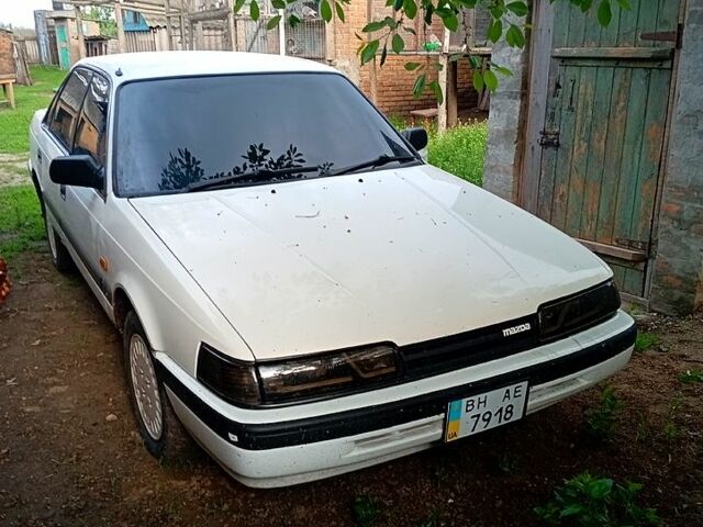 Белый Мазда Капелла, объемом двигателя 2 л и пробегом 150 тыс. км за 1500 $, фото 2 на Automoto.ua