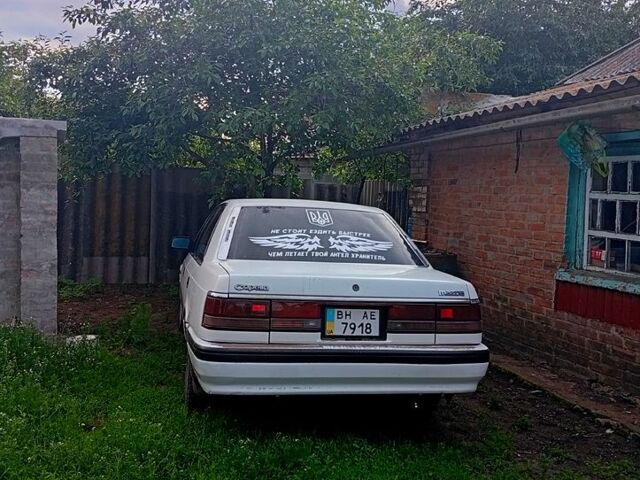 Белый Мазда Капелла, объемом двигателя 2 л и пробегом 150 тыс. км за 1500 $, фото 5 на Automoto.ua