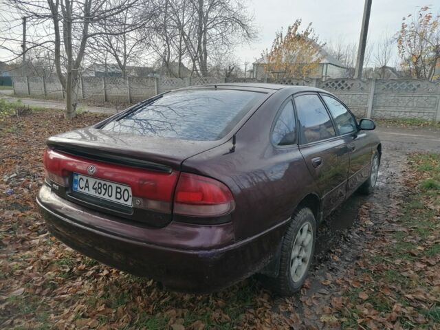 Фиолетовый Мазда Кронос, объемом двигателя 2 л и пробегом 250 тыс. км за 1700 $, фото 1 на Automoto.ua