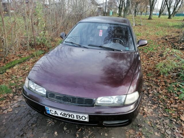 Фиолетовый Мазда Кронос, объемом двигателя 2 л и пробегом 250 тыс. км за 1700 $, фото 2 на Automoto.ua