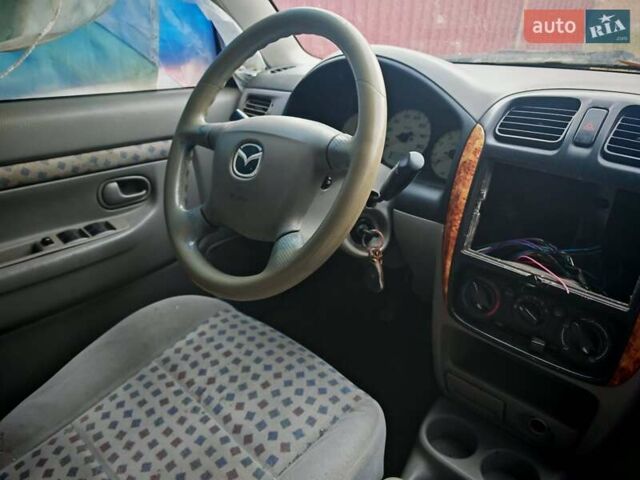 Черный Мазда Демио, объемом двигателя 1.5 л и пробегом 280 тыс. км за 2500 $, фото 2 на Automoto.ua