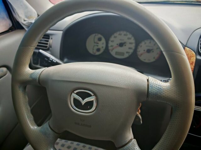 Черный Мазда Демио, объемом двигателя 1.5 л и пробегом 280 тыс. км за 2500 $, фото 7 на Automoto.ua