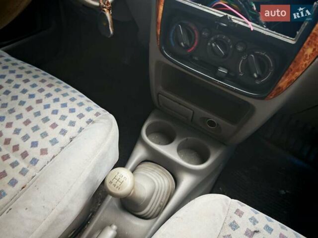 Черный Мазда Демио, объемом двигателя 1.5 л и пробегом 280 тыс. км за 2500 $, фото 3 на Automoto.ua