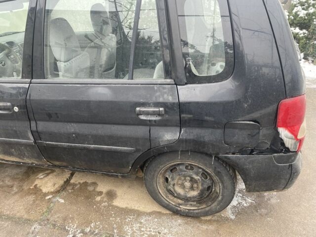 Чорний Мазда Деміо, об'ємом двигуна 1.5 л та пробігом 258 тис. км за 1200 $, фото 4 на Automoto.ua