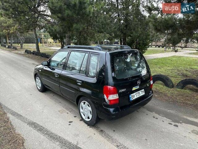 Чорний Мазда Деміо, об'ємом двигуна 1.5 л та пробігом 335 тис. км за 1950 $, фото 4 на Automoto.ua