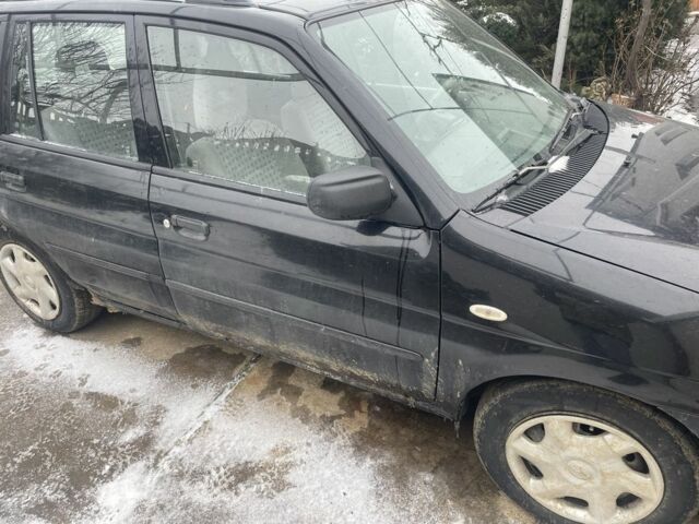 Чорний Мазда Деміо, об'ємом двигуна 1.5 л та пробігом 258 тис. км за 1200 $, фото 2 на Automoto.ua