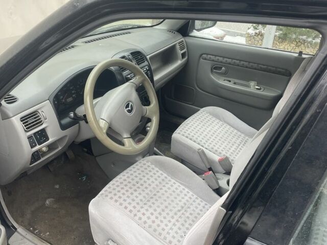 Чорний Мазда Деміо, об'ємом двигуна 1.5 л та пробігом 258 тис. км за 1200 $, фото 5 на Automoto.ua