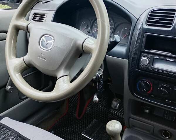 Сірий Мазда Деміо, об'ємом двигуна 1.32 л та пробігом 218 тис. км за 2500 $, фото 8 на Automoto.ua